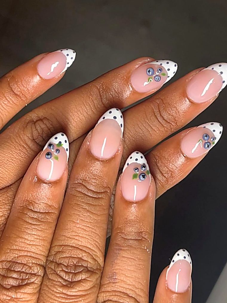 Candy-stripe pink and white nails with silver charms
